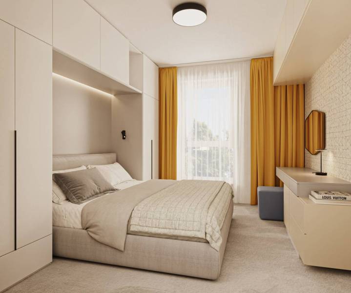 A bedroom with a large bed, yellow curtains, and stylish furniture.
