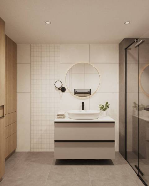 Bathroom with a mirror, modern sink, and wooden elements on storage cabinets.