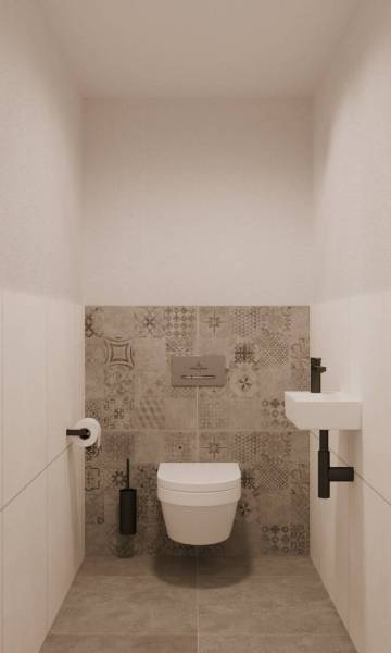 A toilet with a wall-hung bowl and patterned tiles in a building, elegant design.