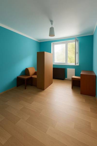 A room in a family house with a wooden decor floor and turquoise walls.