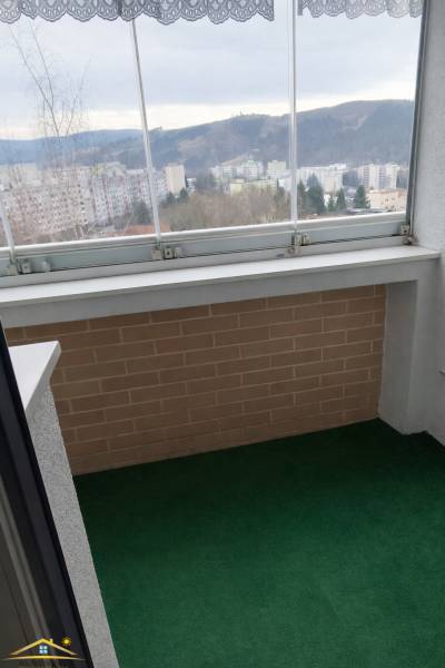 A glazed balcony with a view of Čadca, part of a 3-room apartment.
