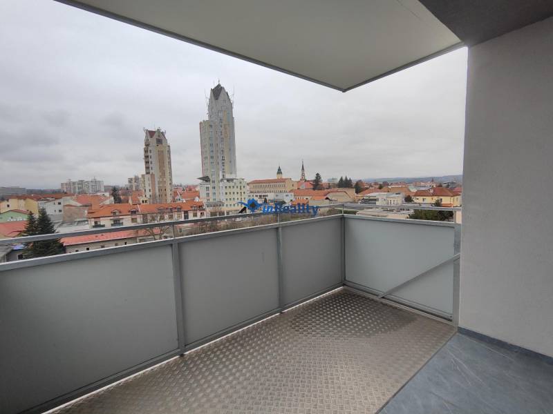 The balcony of a 2-room apartment on Majakovského Street in Lučenec with a city view.