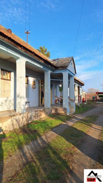 A family house in Rapovce with a veranda and sunlight illumination.