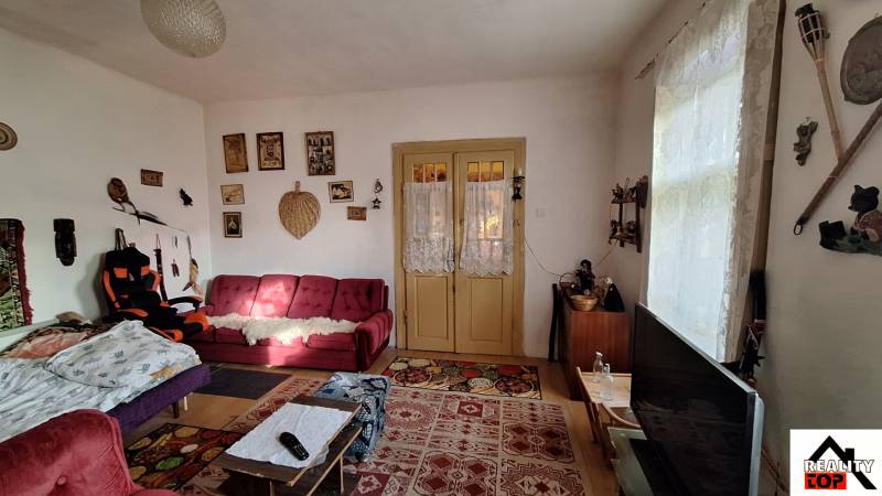 Living room in a family house with antique furniture and decorations, floor with wooden decor.