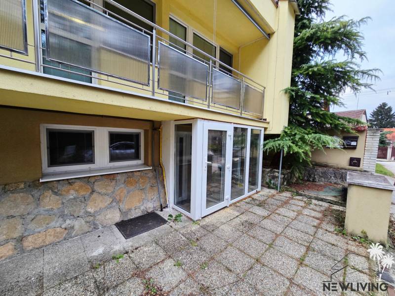 A courtyard with paving at a one-room apartment on Lesná Street in Banka.