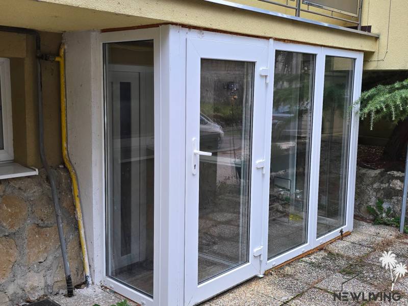 White glass veranda behind the house on Lesná Street in Banka.