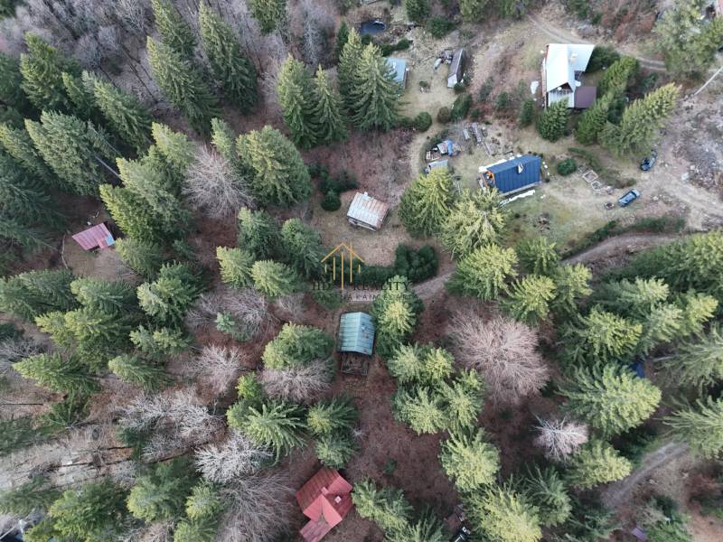 An aerial view of cabins surrounded by forests in Krpáčovo at Krpáčovo.