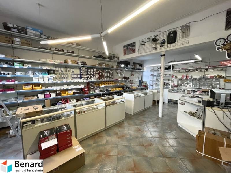 Interior of a building with a range of parts, shelves, and displayed goods.