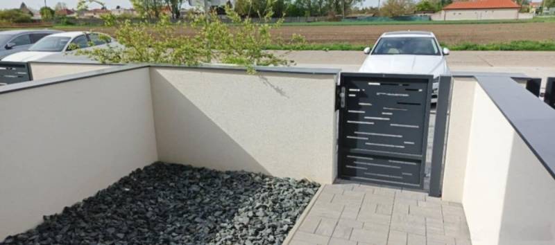 Part of a 3-room apartment in Diakovce, a terrace with tiles and decorative stones.