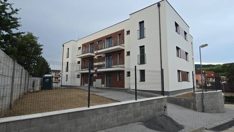 Apartment building on Banka Street in Piešťany with a garden and balconies.