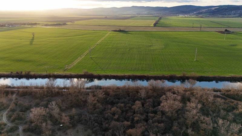 A landscape with fields and a river near Nová Ves nad Váhom, recreational plots.