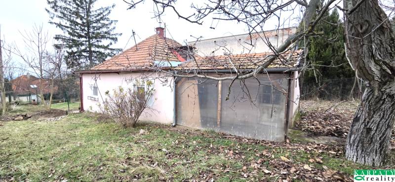 A family house on 29th August Street in Levice, in a spacious garden with numerous trees.