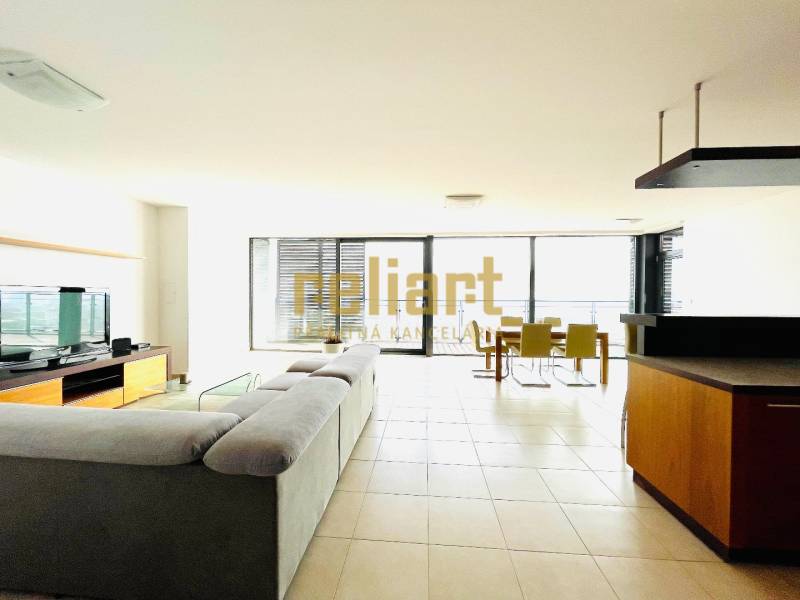 Living room with a large sofa in a 4-room apartment, smooth floor, glass walls.