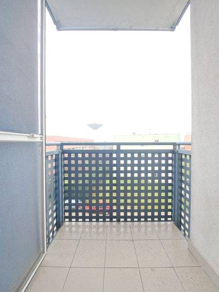 Balcony in Galanta from a 2-room apartment with railing and tiles, view of the city.