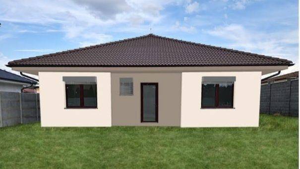 A family house in Kolónia, Galanta, with a dark roof and a grassy garden.