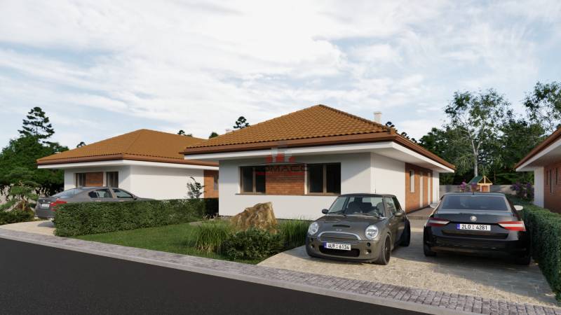 A family house on Veselé Street in the town of Veselé with two cars in the driveway.