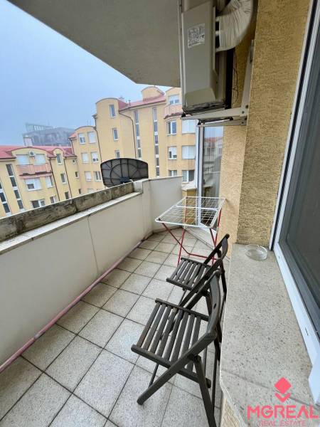 A balcony in an apartment with two chairs on Kýčerského Street in Bratislava - Old Town.