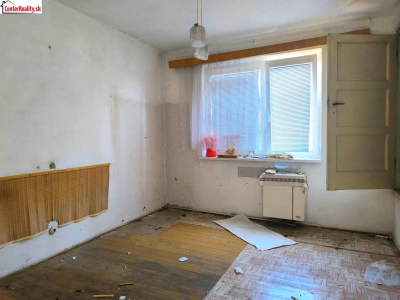 Necessary renovation of a room in a family house, preserving natural light from the window.