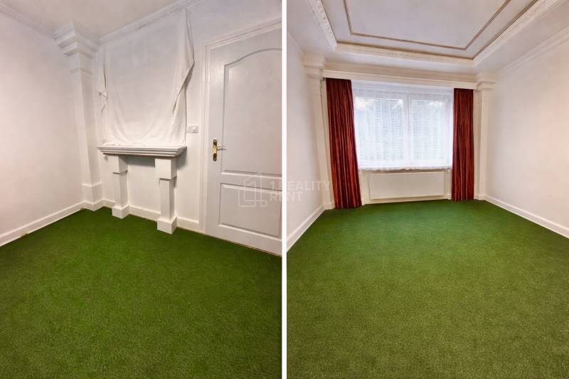 A room with white walls and a green carpet in a two-room apartment.