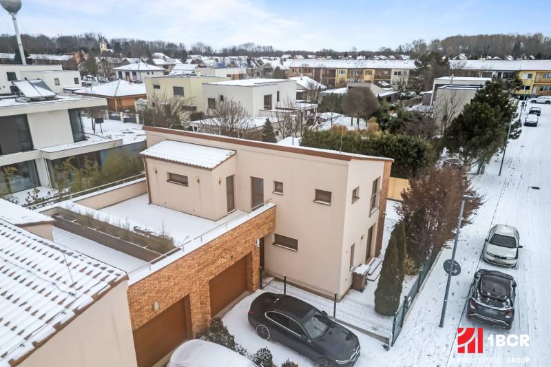 A snow-covered family house on Konopiská Street in Bratislava-Čunovo.