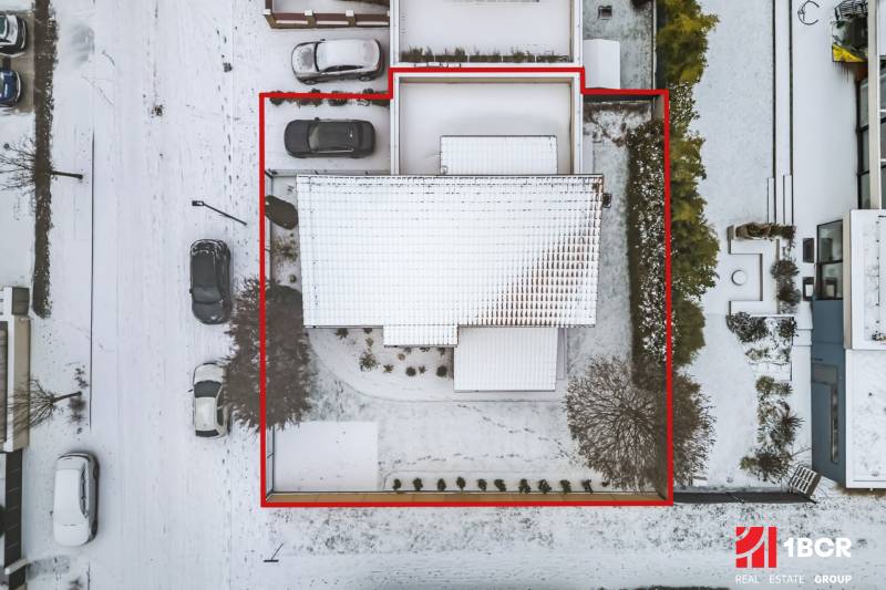 Aerial view of a snow-covered family house with a plot on Konopiská Street in Bratislava - Čunovo.