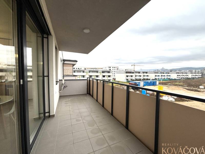 The balcony offers a view of the construction on Vladimíra Predmerského Street in Trenčín.