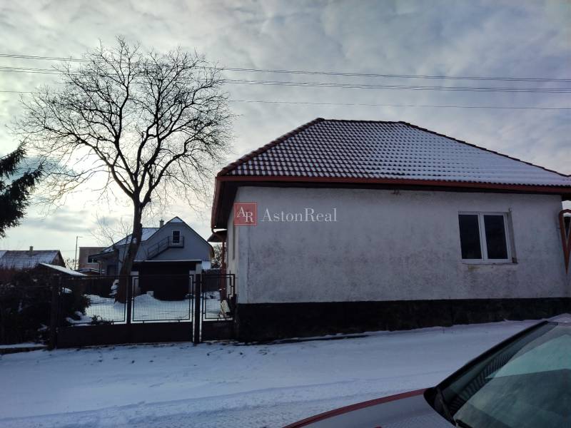 A family house on Hájska Street in Martin with a snow-covered roof and garden.