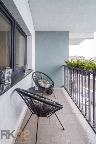 A balcony of a family house with comfortable chairs and a table, Krátka Street, Spišské Bystré.