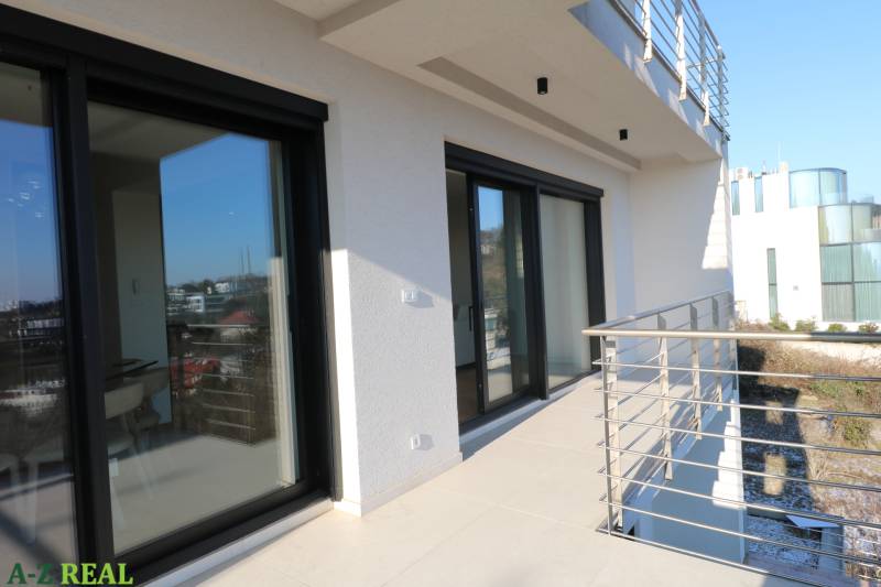 The balcony of a 4-room apartment on Broskyňová Street, Bratislava - Staré Mesto, with modern railings.