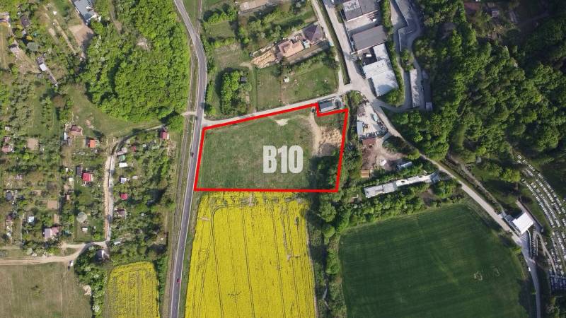 Aerial view of residential plots in Trenčianske Teplice surrounded by greenery.