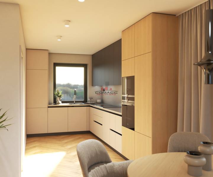 A kitchen with wooden cabinets and a window, on Špačince street in a family house.