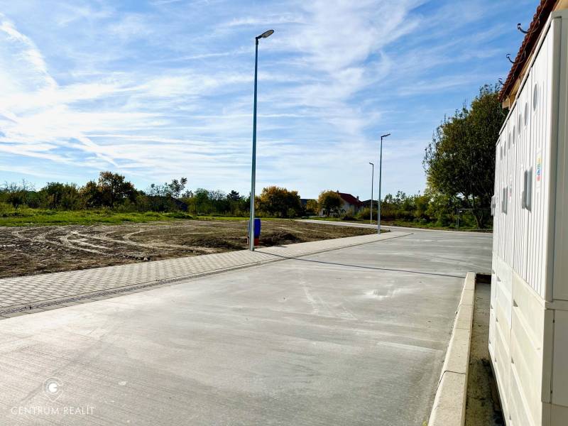Cintorínska Street in Malinovo, the right side shows a paved road near the Family House.