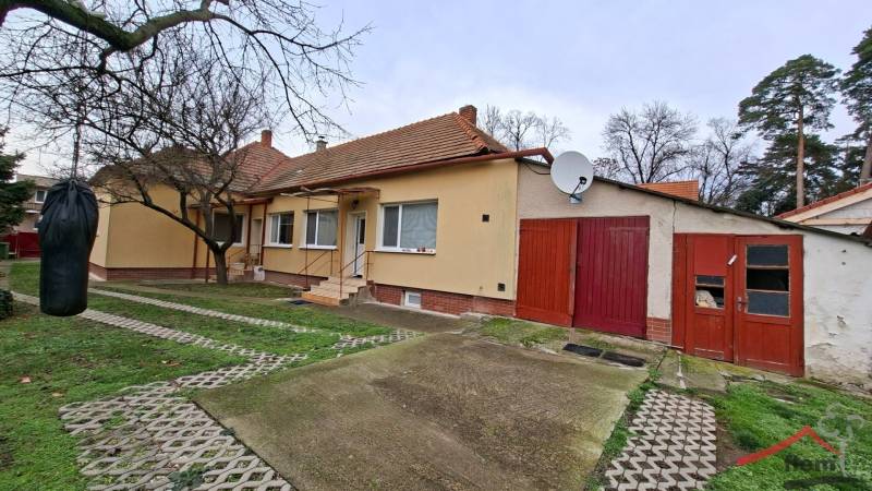 A family house in Nová Ves nad Žitavou on Nová Ves nad Žitavou street with a garage and a punching bag.
