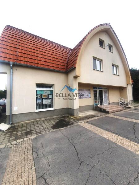 The building on Children's Square in Galanta with a red arched roof and an entrance ramp.