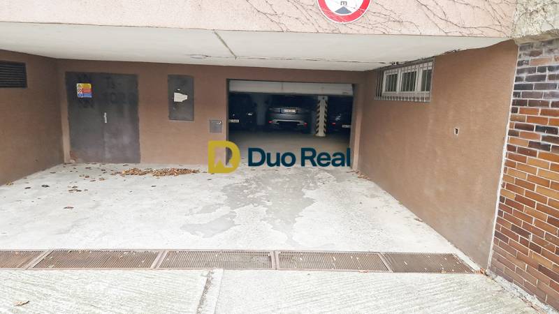 Entrance to the garages on Gajova Street in Bratislava - Old Town, with parked cars.