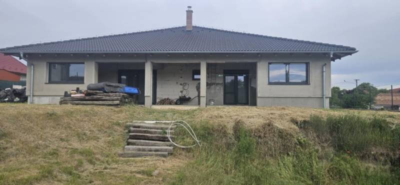 A family house in Semerovo with an unfinished terrace and a well-maintained yard.