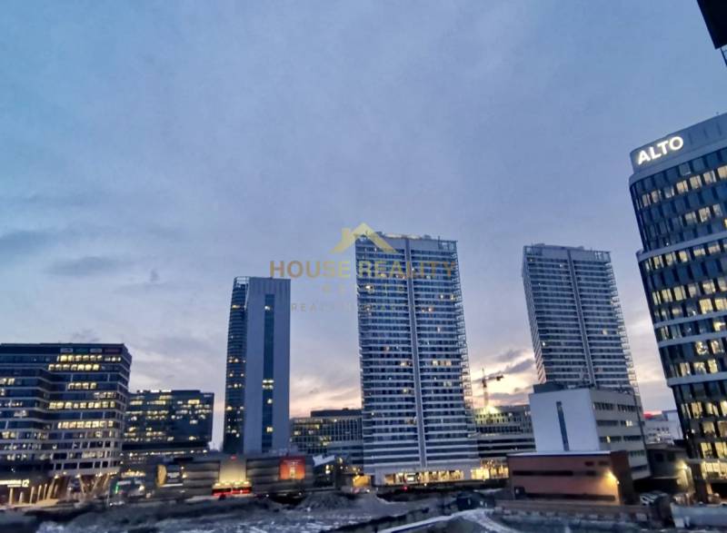 The panorama of high-rise buildings on Bottova Street in Bratislava at dusk.
