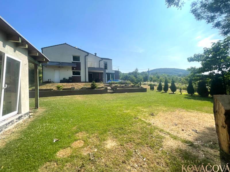 A family house in Melčice-Lieskové with a spacious garden and a beautiful view of the mountains.