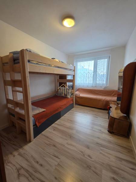 Children's room in a 3-room apartment with light and a bunk bed, floor with wooden decor.