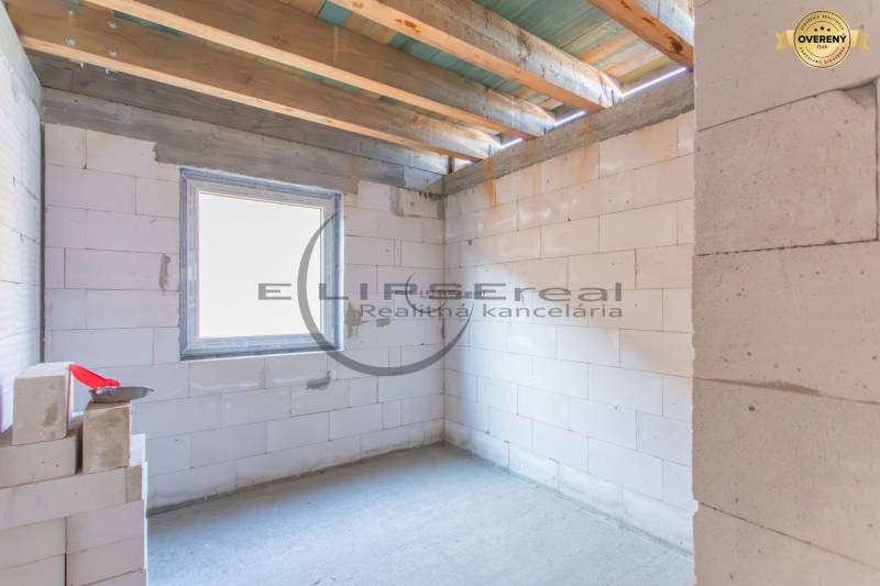 Interior of a building with white bricks and a window in the style of Veľké Leváre.