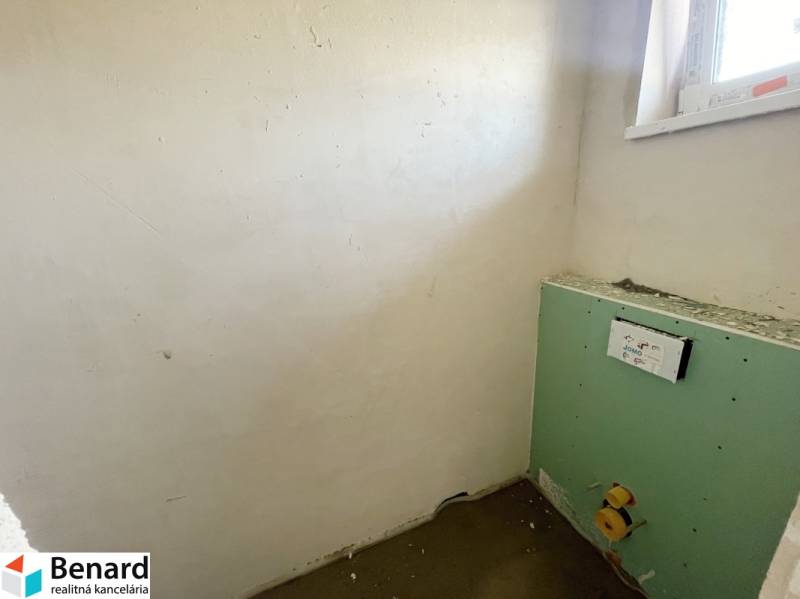 An empty room in a family house prepared for the installation of sanitary facilities.
