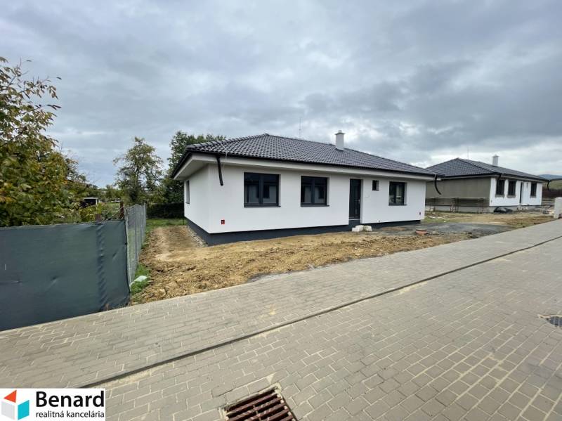A family house in Soľ with a white facade and a dark roof.