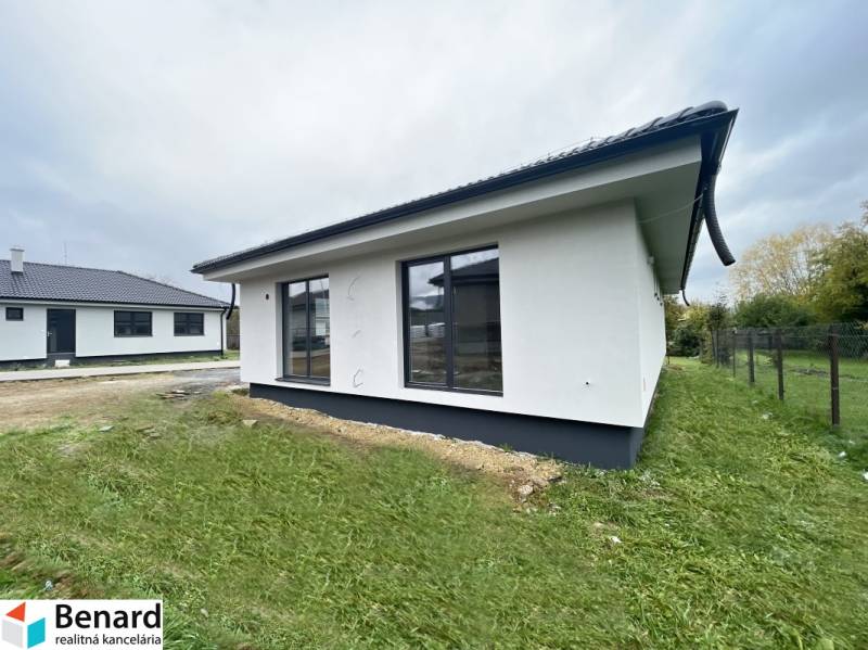 A family house in Prešov with a garden and large windows, featuring spacious and bright interiors.