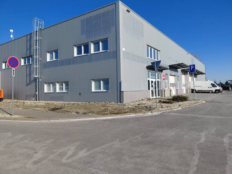 Warehouses and halls on Technická Street in Bratislava - Ružinov with parking and traffic signs.