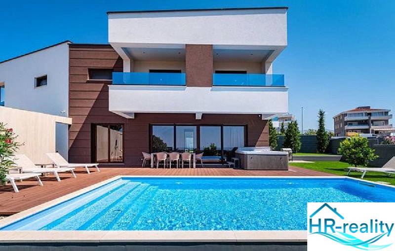 Villa in Novalja with a lawn, pool, and terrace for a comfortable stay.