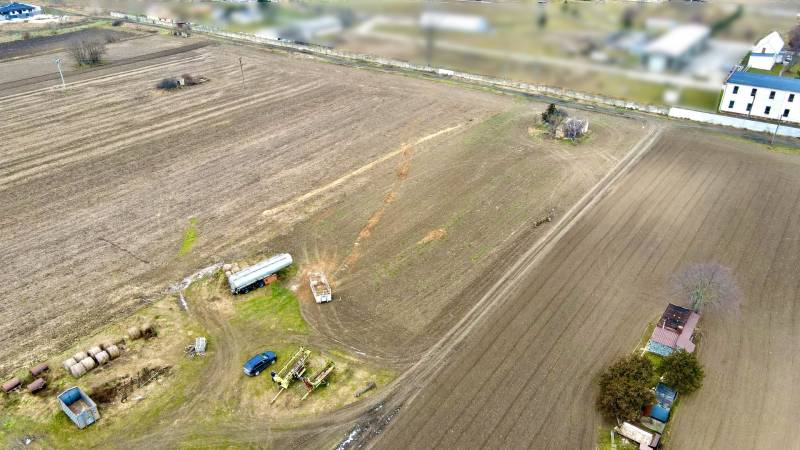 A view of arable fields with agricultural machinery on Kasárenská Street in Sereď, Land - housing.