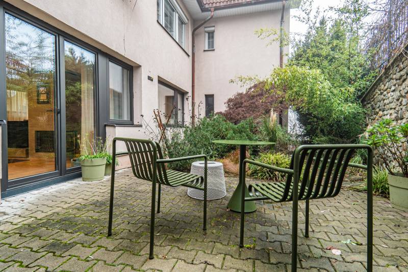 Exterior of a 4-room apartment on Tichá Street in Bratislava - Old Town with garden furniture.