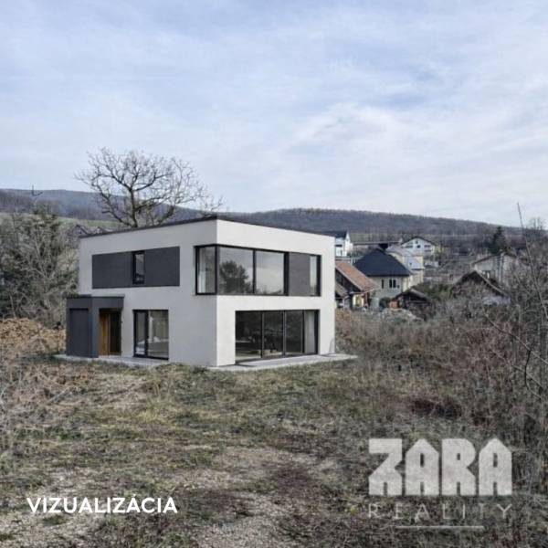 House in Residential Land - surrounded by nature in the town of Nováčany, with hills in the background.