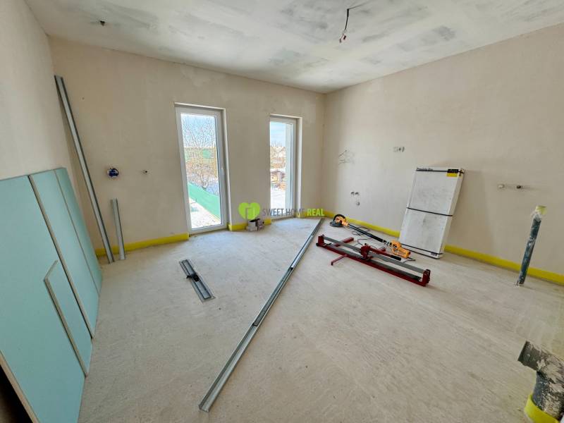 The interior of a family house in the renovation phase with tools and building materials.
