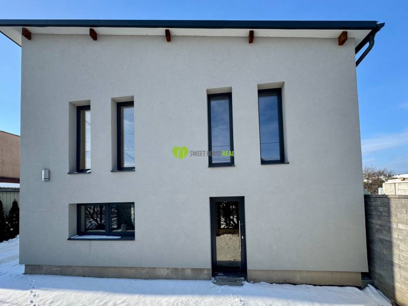 A family house on Gyňovská Street in Čaňa with a minimalist design and modern windows.